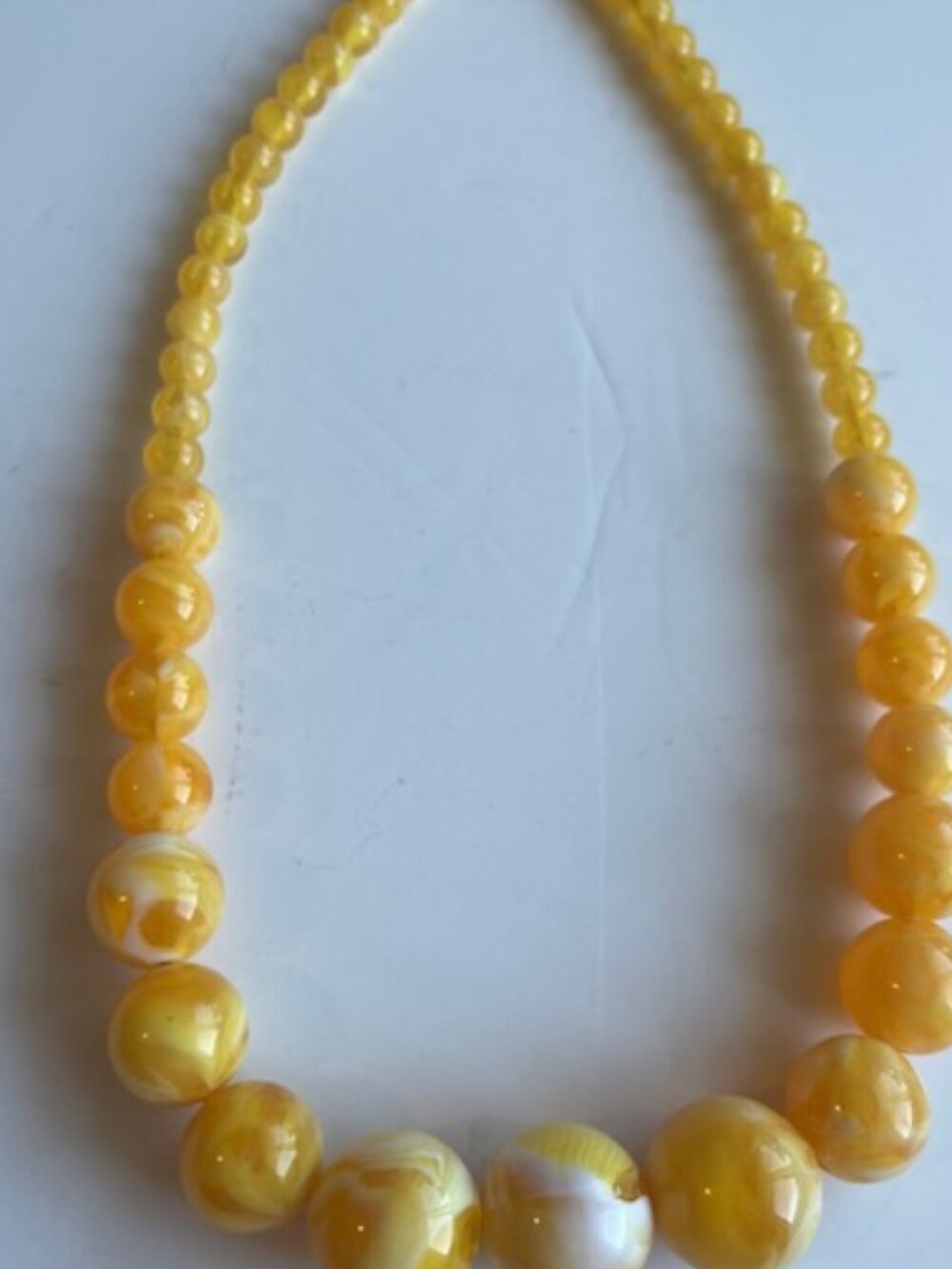 Yellow Lucite necklace.